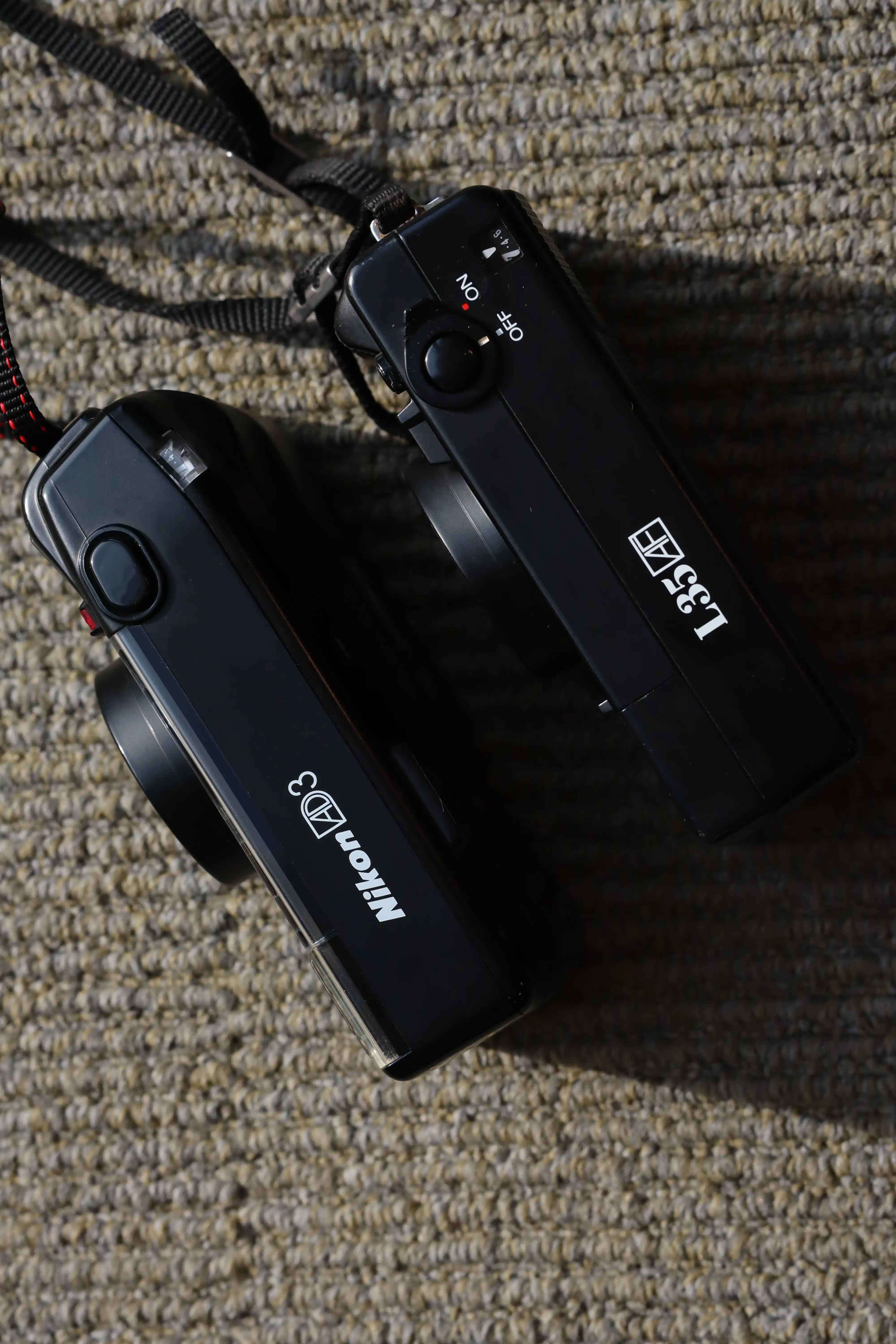 Nút chụp của Nikon L35 AD3 có cảm giác tốt hơn Nikon L35 AF